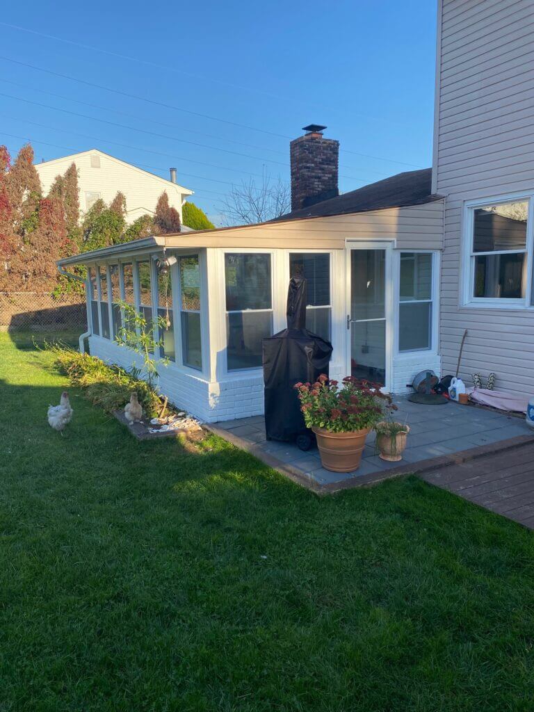 Sunroom addition with a wall of windows on a New Jersey home