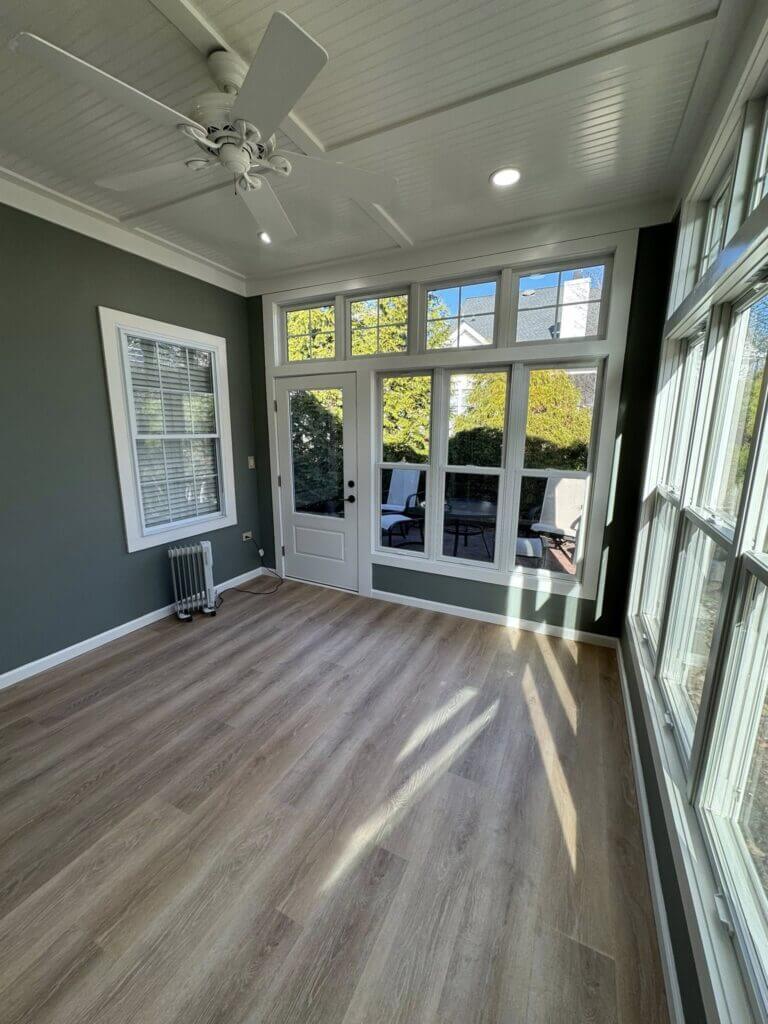 Sunroom with a beadboard ceiling, French doors and wide plank flooring