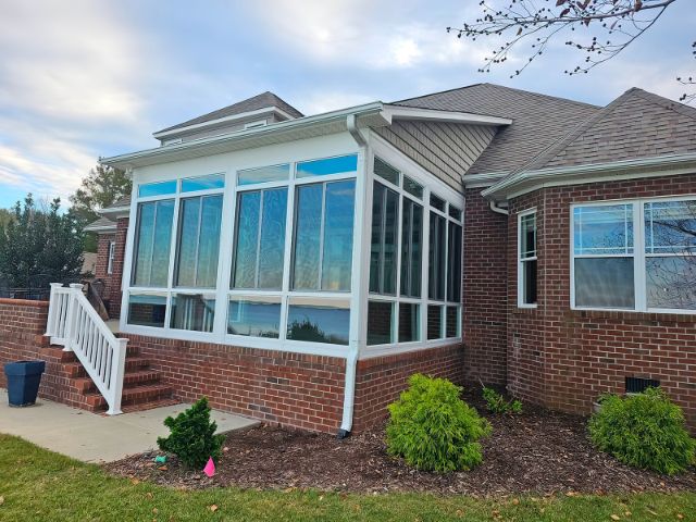 sunroom with brick walls