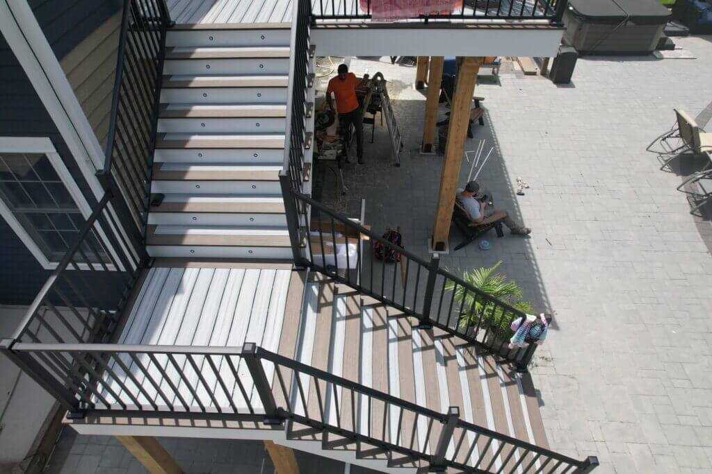 Multi-level deck with railings by Legion Build in Union, NJ