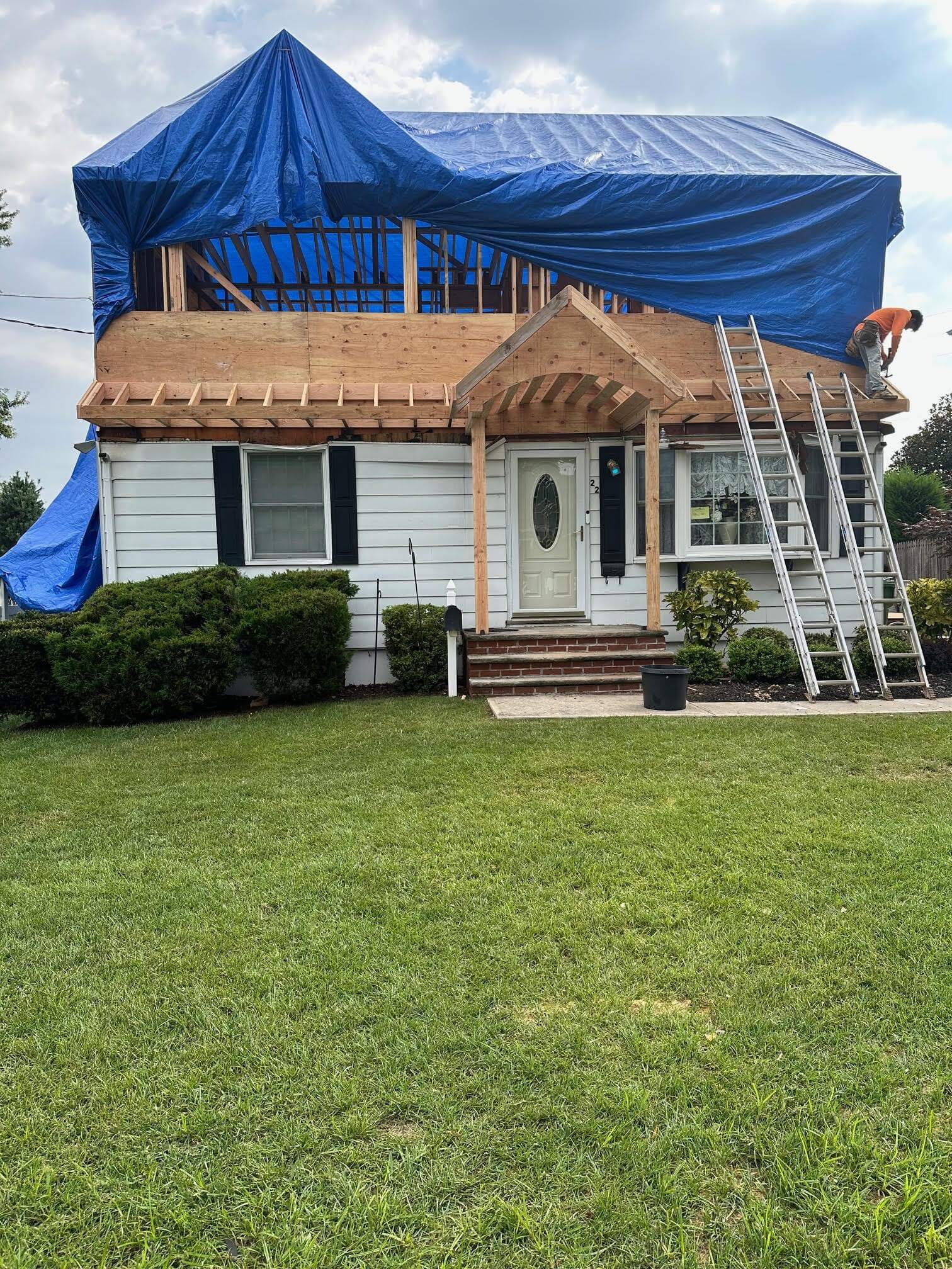 middlesex county second story addition with tarp in progress