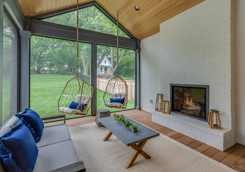 four season sunroom in nj with hanging chairs