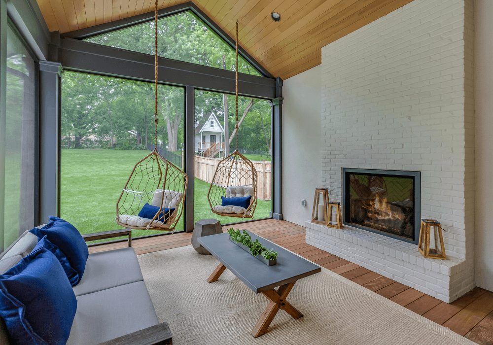 four season sunroom in nj with hanging chairs